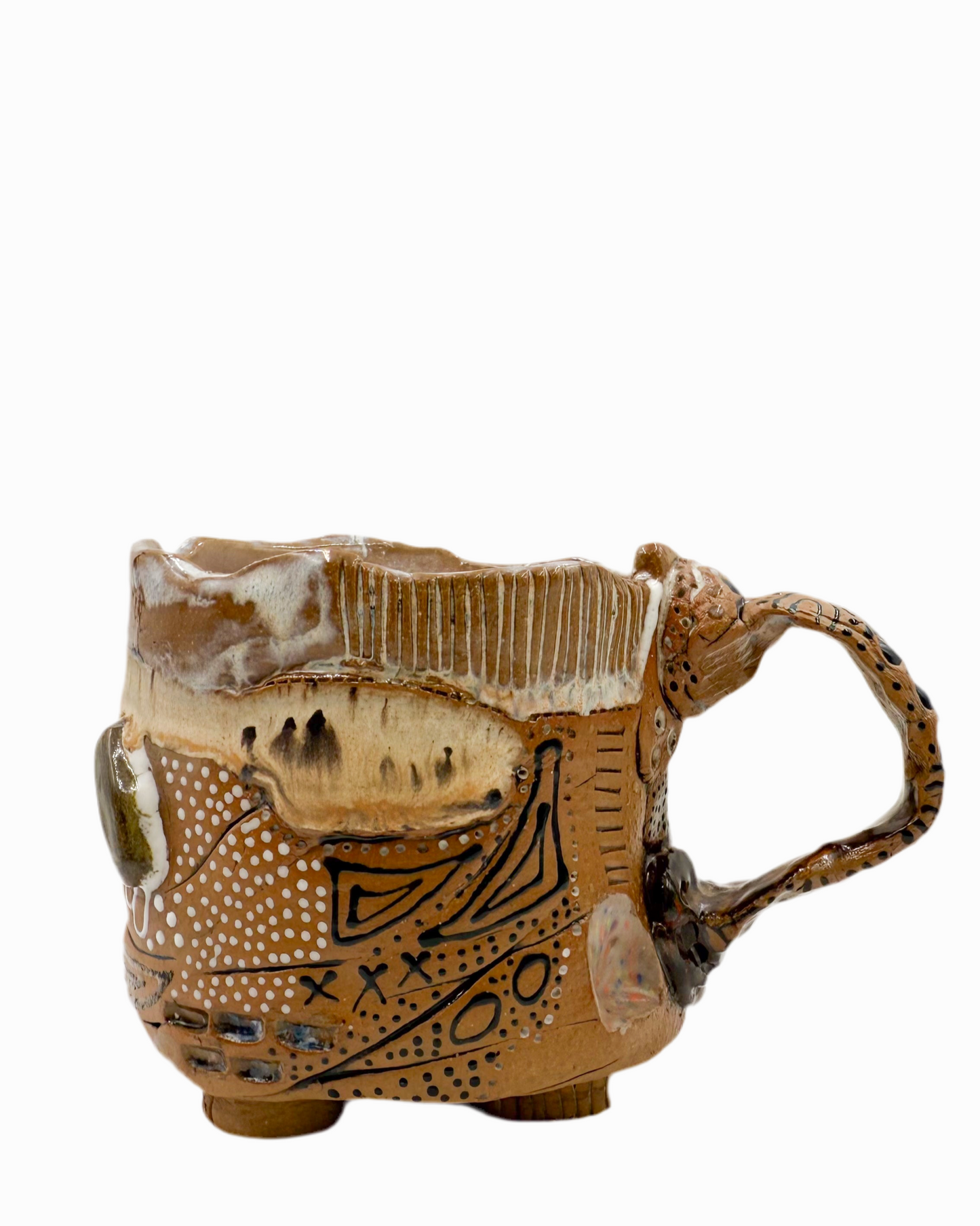 Pictured is a handmade ceramic mug that is full of gloops and globs allowing the mug holder to have a tactile experience while enjoying their peferred drink.