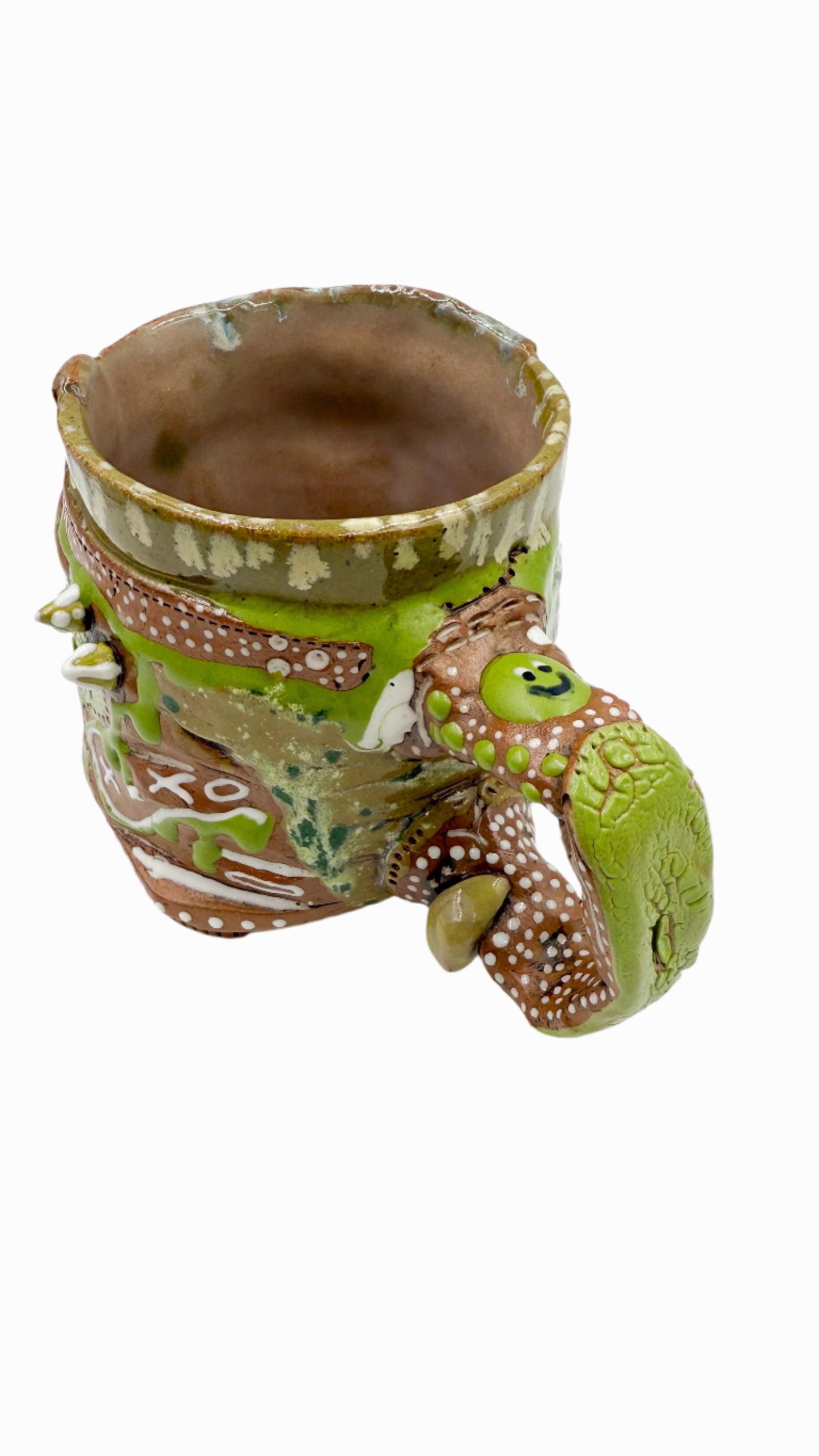 Pictured is a handmade ceramic mug that is full of gloops and globs allowing the mug holder to have a tactile experience while enjoying their peferred drink.
