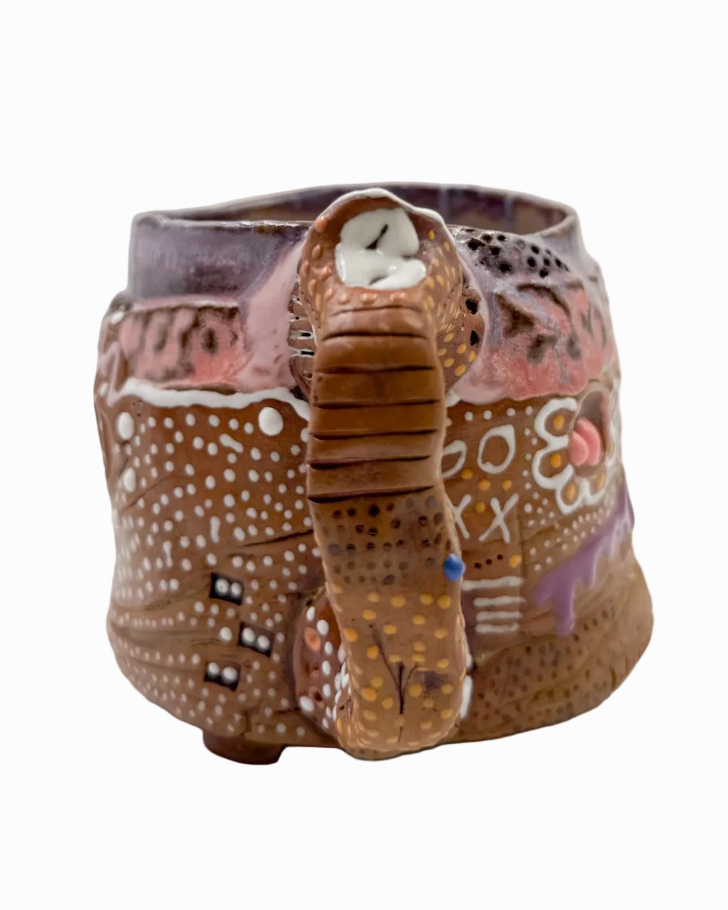 Pictured is a handmade ceramic mug that is full of gloops and globs allowing the mug holder to have a tactile experience while enjoying their preferred drink.
